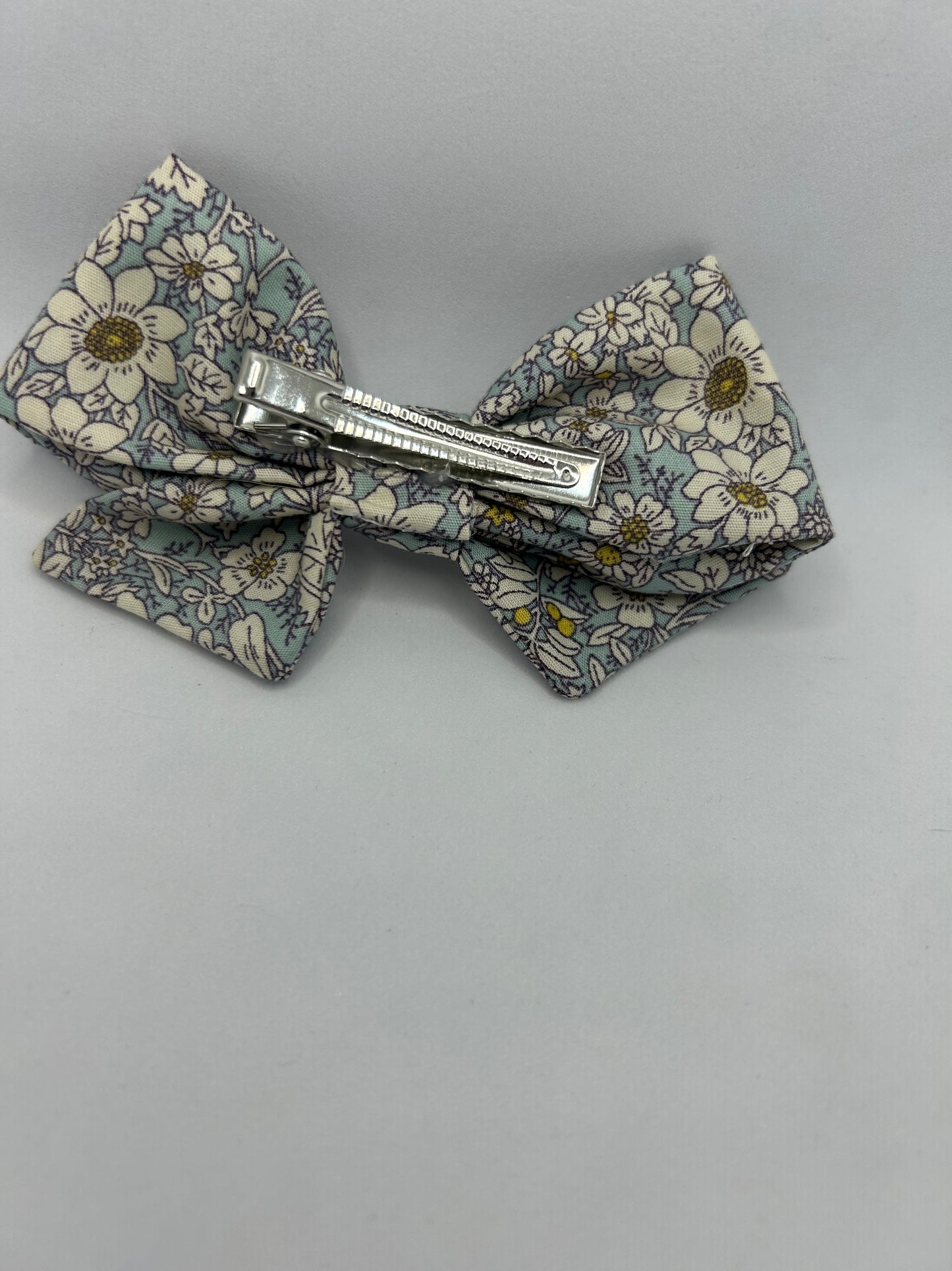 Blue rose and hubble pinwheel fabric bow