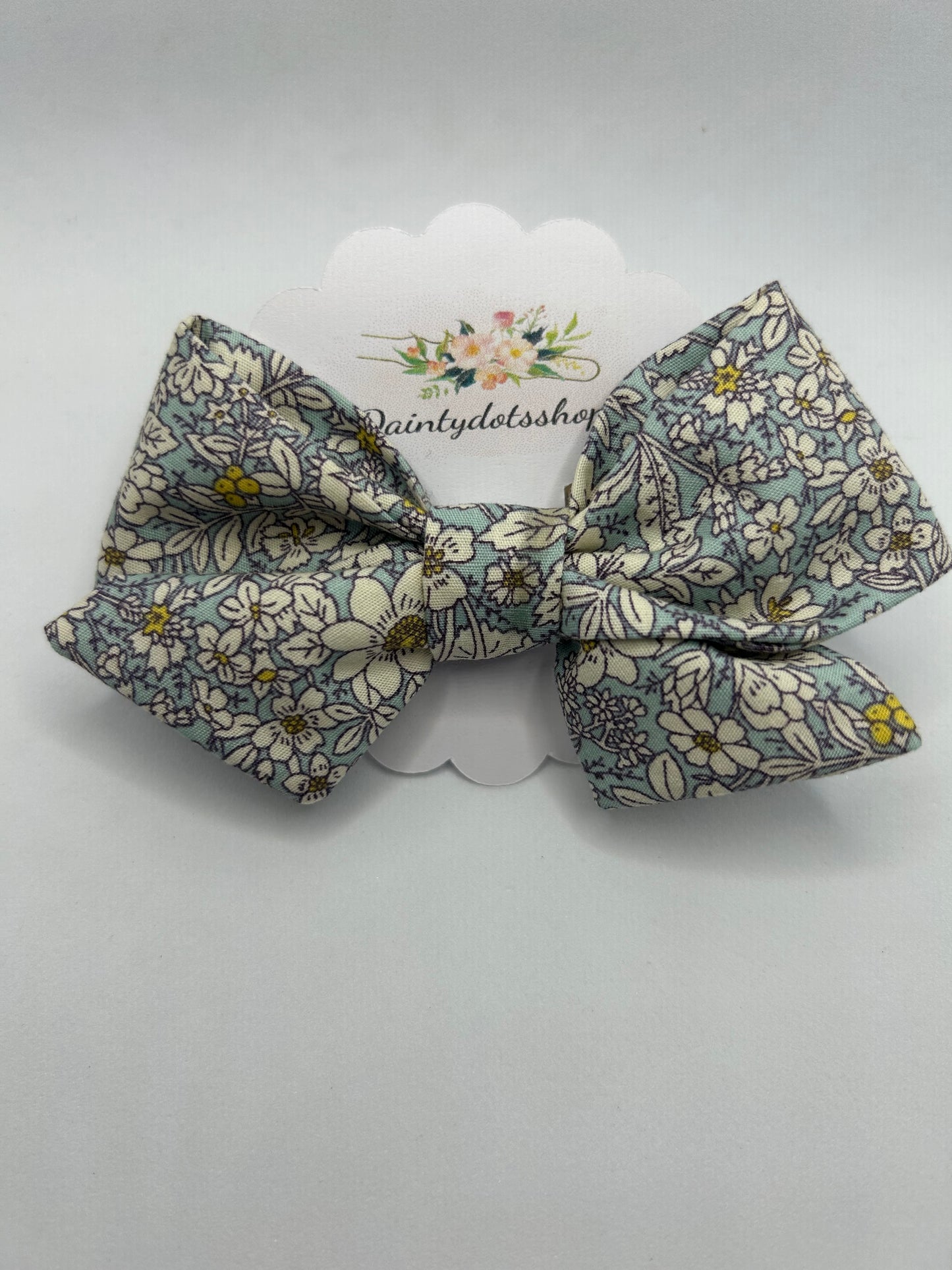 Blue rose and hubble pinwheel fabric bow