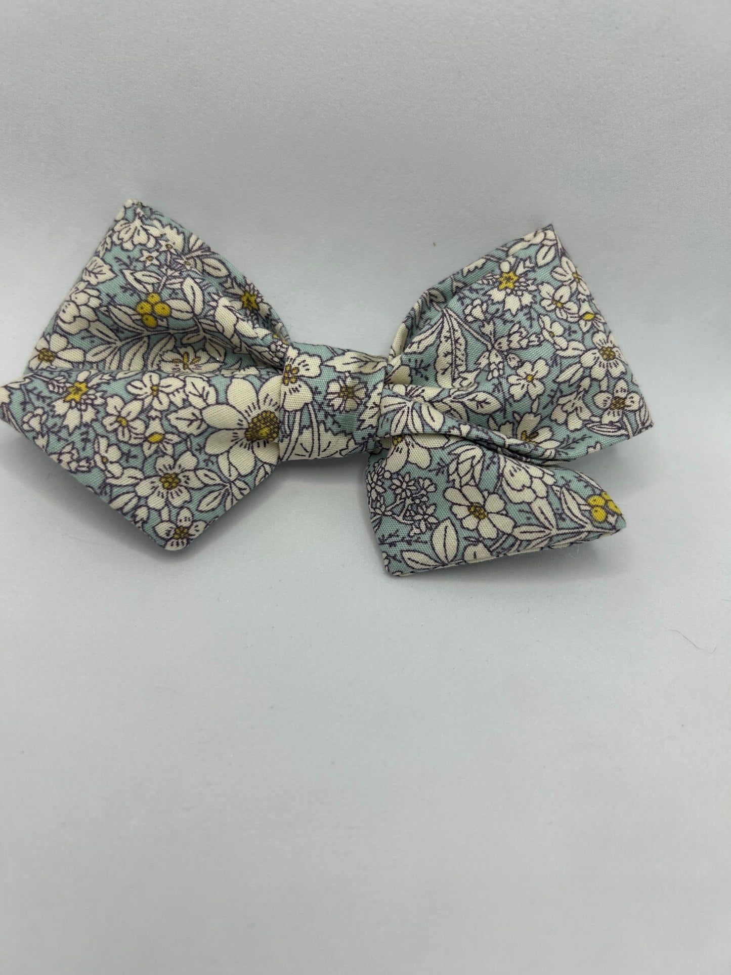 Blue rose and hubble pinwheel fabric bow