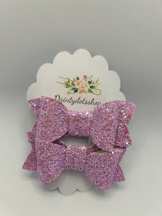 A pair of lilac frost glitter bows ideal as a gift or stocking filler.