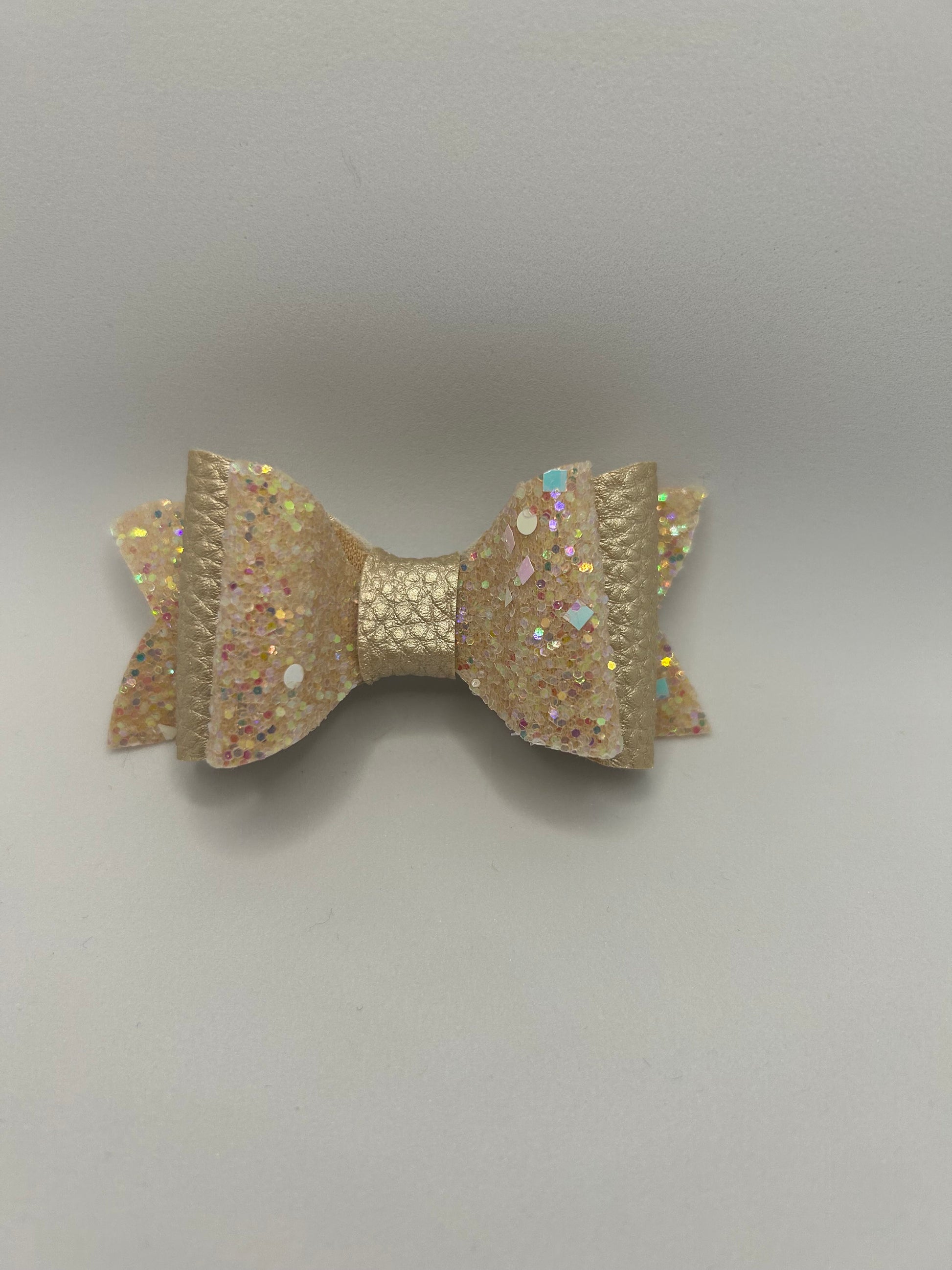 Champagne chunky double glitter with nude leatherette bow sold singular. Christmas Eve box/stocking filler