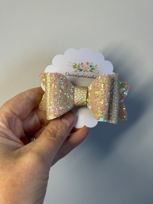 Champagne chunky double glitter with nude leatherette bow sold singular. Christmas Eve box/stocking filler