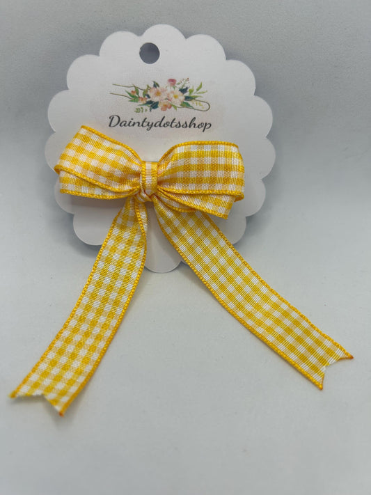 Yellow gingham ribbon bow with alligator clip. Ideal for school