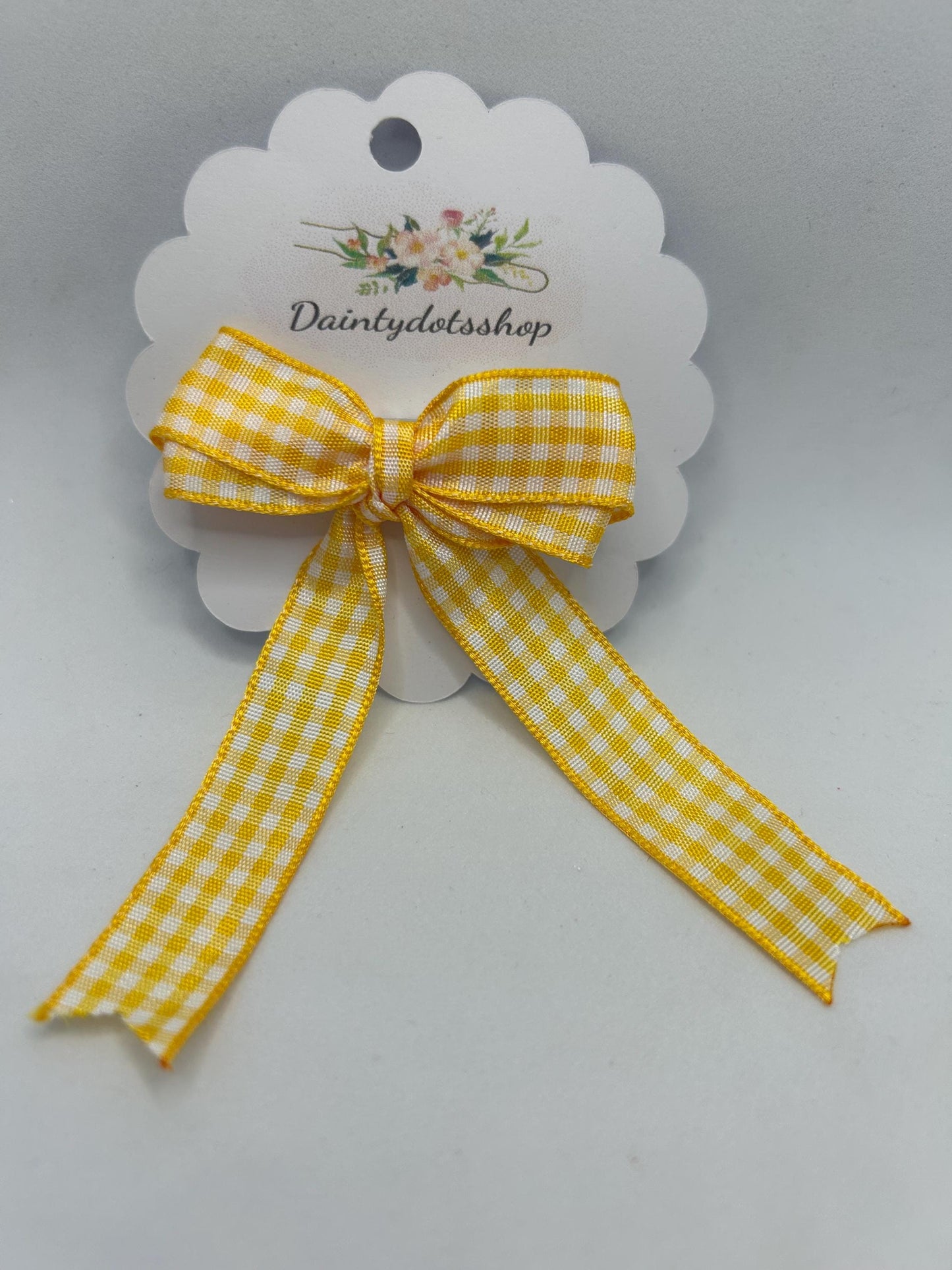 Yellow gingham ribbon bow with alligator clip. Ideal for school