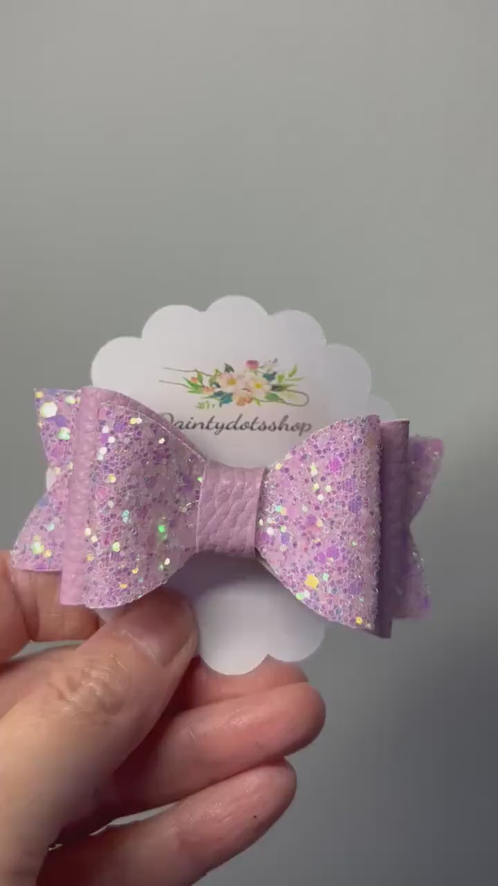 Glitzy Pink Delights, double glitter and pink leatherette bow sold singular.